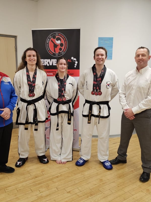 Joe with team mates and judges