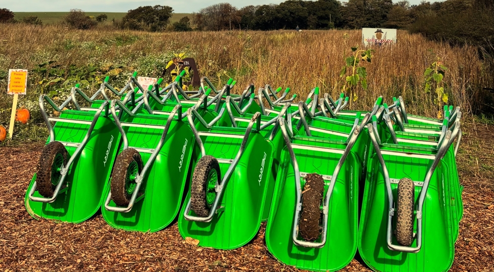 neatly stacked wheelbarrows